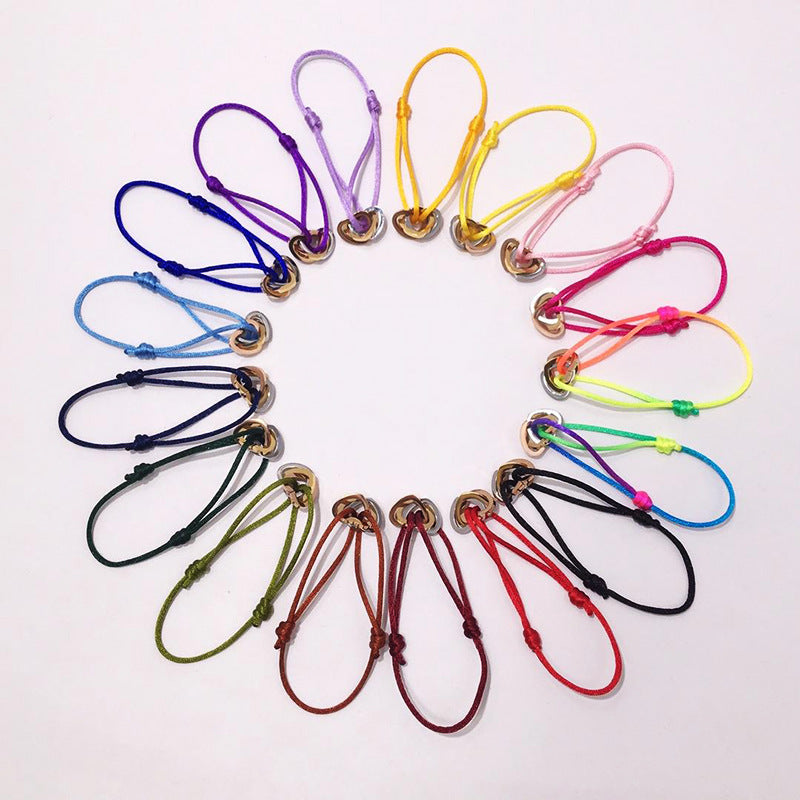 The hand rope is fashionable and does not fade. Titanium steel bracelet has three rings and three colors. Hollow love-shaped male and female couples colored hand rope.