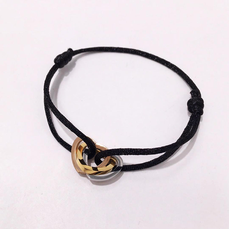 The hand rope is fashionable and does not fade. Titanium steel bracelet has three rings and three colors. Hollow love-shaped male and female couples colored hand rope.